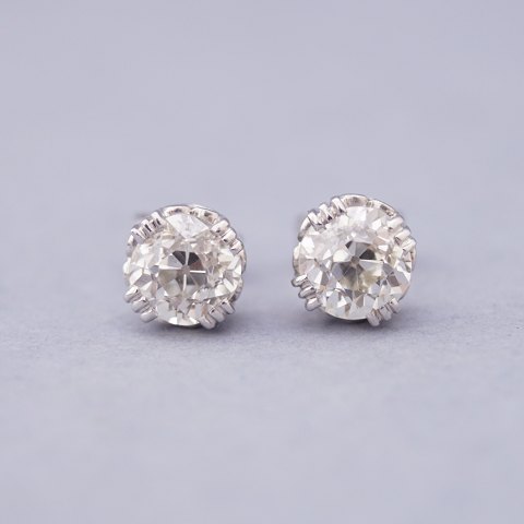 Pair of earrings set with one big brillant in each, in total 2,50 ct. mounted in 
14 kt. white gold