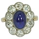 Ring of 14k gold set with a sapphire and brillant-cut diamonds