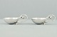 Georg Jensen; A set of two salt cellars with spoons, silver #110, G.J. 1927