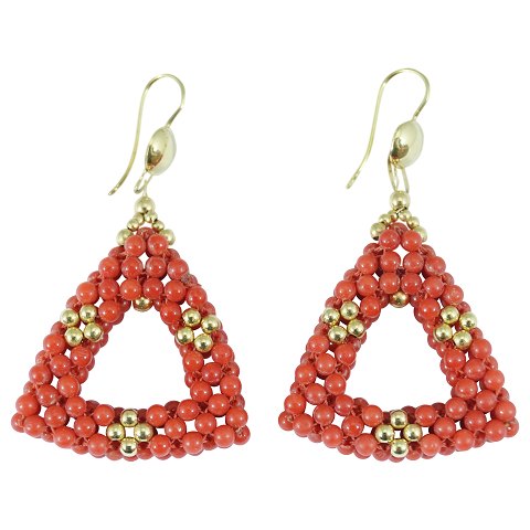 A pair of coral earrings of 14k gold