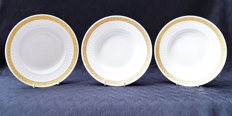 Royal Copenhagen; Gold fan, three deep plates #115151