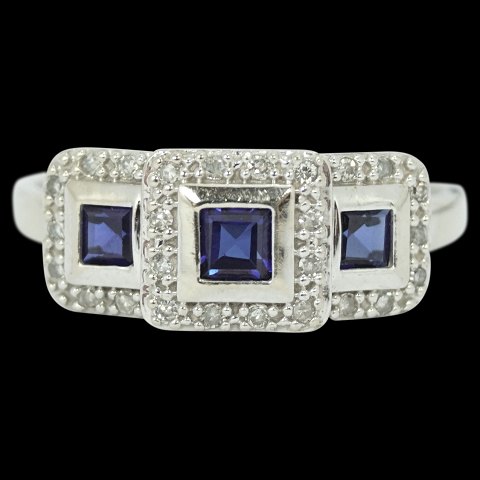 A ring of 10k white gold set with sapphires and diamonds