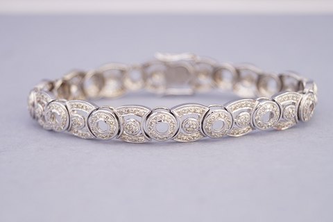 A diamond bracelet mounted in 14k white gold