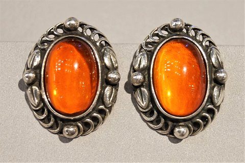 Georg Jensen; Heritage jewellery, earclips 1995 set with amber, made of sterling 
silver