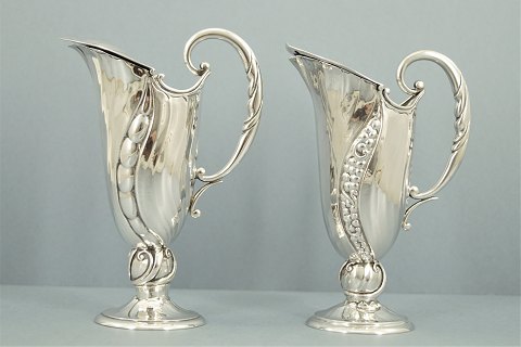 Kay Bojesen; A pair of oil-vinegar jugs of silver with enamel