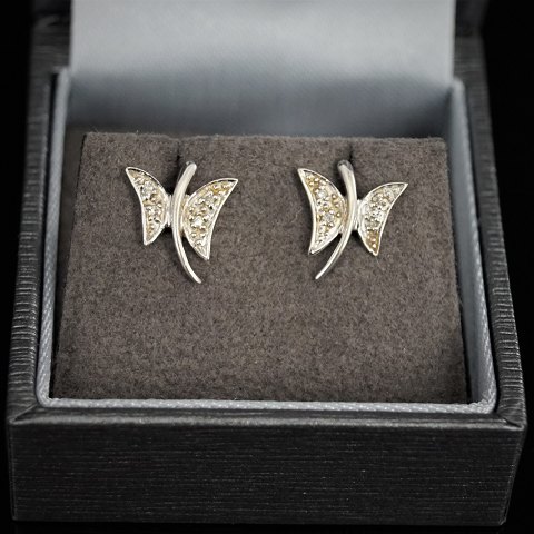 Earrings of 14k white gold set with diamonds