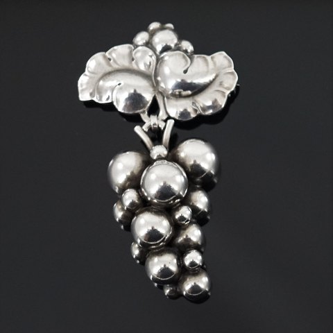 Georg Jensen; A Moonlight Grapes brooch of sterling silver #217 B