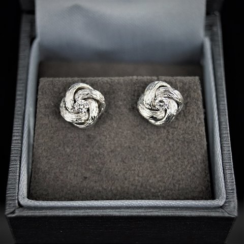 Earrings of 14k white gold set with diamonds