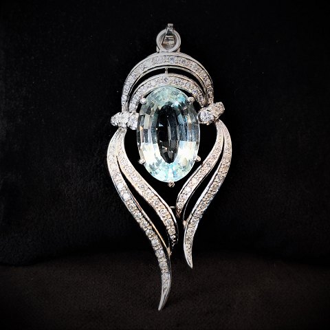 A pendant set with an aquamarine, brillants and diamonds mounted in 14k white 
gold