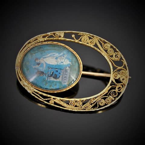 An Empire gold brooch set with a miniature painting