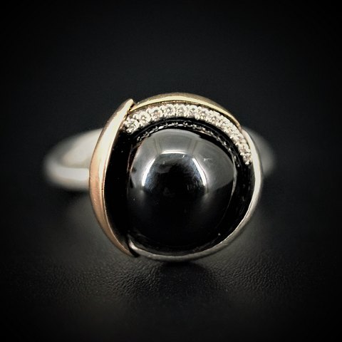 Ole Lynggaard; Lotus ring with onyx and diamonds mounted in sterling silver and 
gold