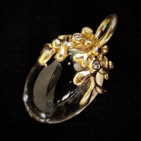 Ole Lynggaard, Charlotte Lynggaard; Pendant of 18k gold with rock crystal and 
diamonds