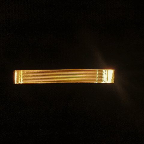 Tie clip of 14k gold
