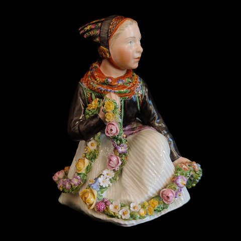 Royal Copenhagen, Carl Martin Hansen; A porcelain figurine of a Amager girl 
#12412