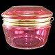 A Fench sugar box of red coloured glass and brass