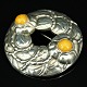 Georg Jensen; A brooch of sterling silver set with amber #42, anniversary brooch 
1904 - 1994