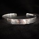 Georg Jensen, Regitze Overgaard; A "Smithy" bangle of sterling silver #590