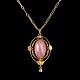 Georg Jensen; A necklace in 18k gold set with a rose quartz